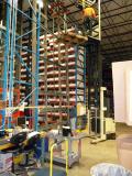 Techs work to break down vertical storage system